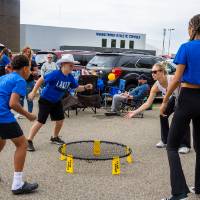 Students play spike ball game during tailgate.